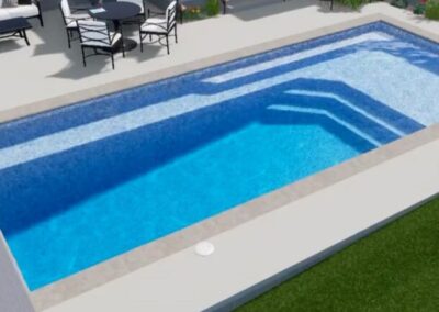 Rectangular inground fiberglass pool with gradual depth decline and sitting areas along the edges