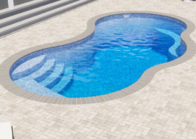 Kidney shaped fiberglass pool with stairs and sitting area in corners