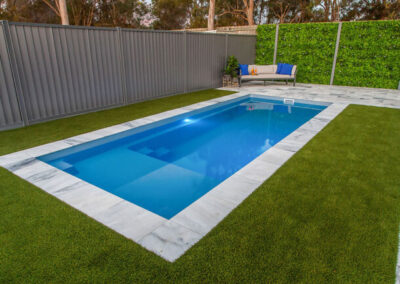 Inground fiberglass rectangular pool with different depths