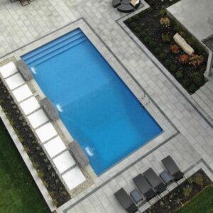 Simple rectangular pool with steps that go across full width