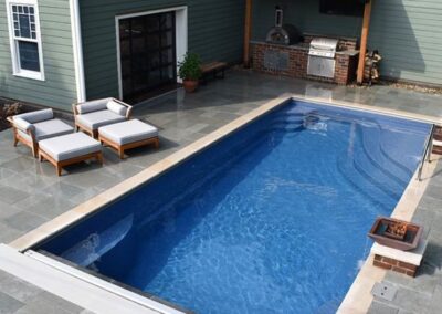 Rectangular pool with different sets of steps in corners