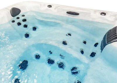 The inside of the Sunrise F Series Hot Tub filled with water showing jets