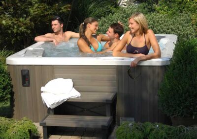 Group of adults in a Sunrise Hot Tub