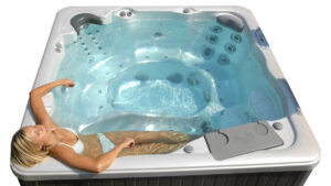 Woman relaxes in a Sunrise Hot tub