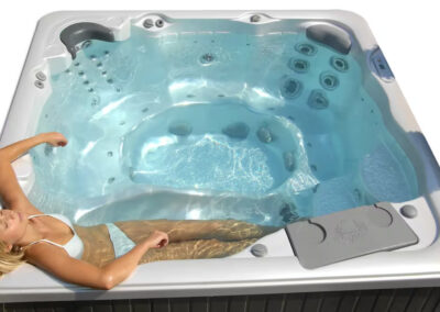 Woman relaxes in a Sunrise Hot tub